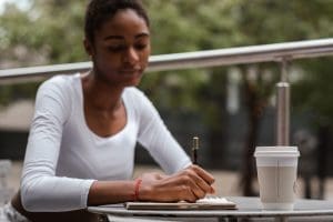 Woman writing a resume