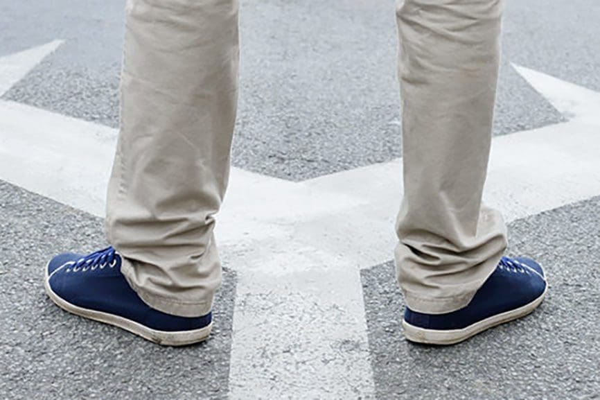 Man standing hesitating to make decision